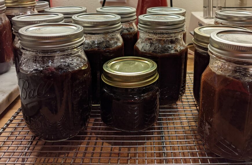 Canning jars full of plum butter